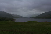 Moody Loch Arklet nestled in the Trossachs in Loch Lomond National Park, Scotland