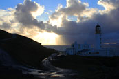 The sun setting on a winter aftenoon at Rua R3eidh Lighthouse near to Melvaig, Wester Ross, Scotland